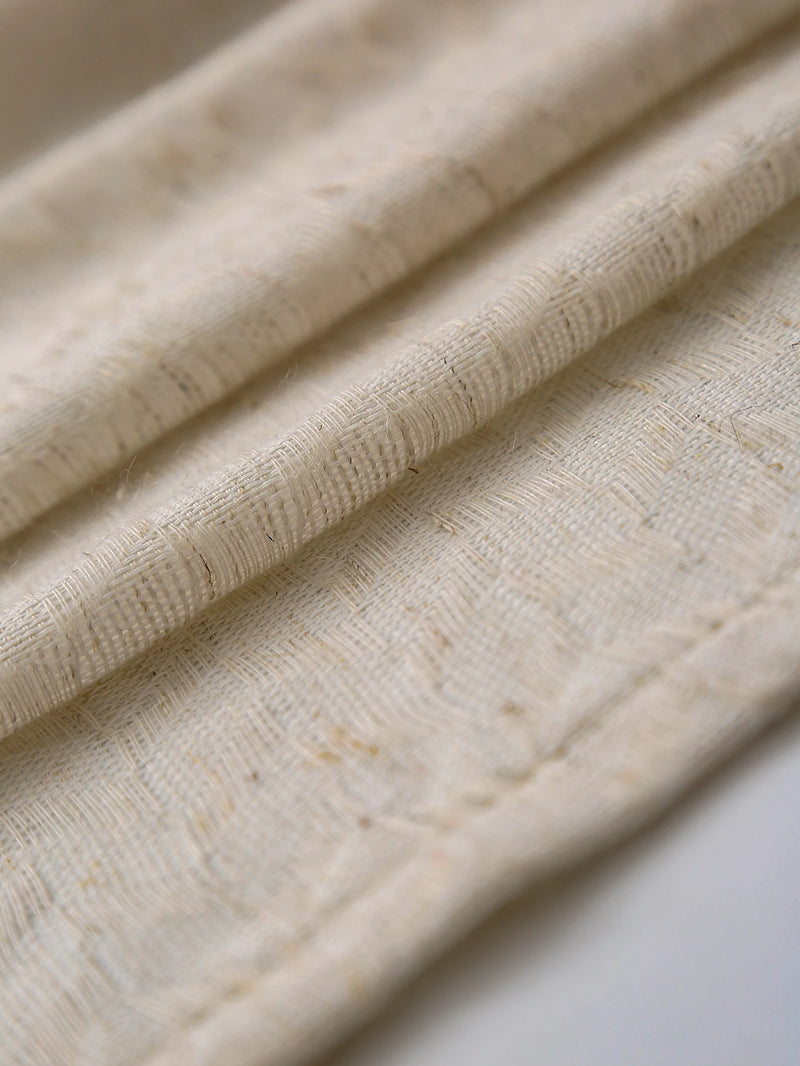 Soft daylight filtering through sheer linen curtains in a living room