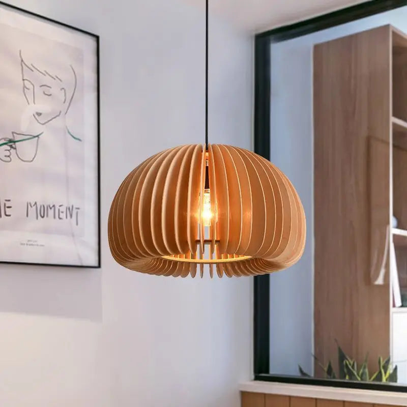 Handmade bamboo pendant lamp glowing against a limewash plaster wall