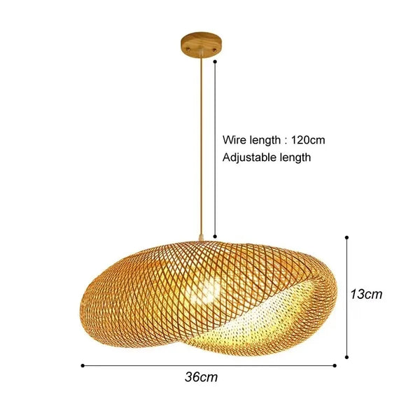 Bamboo pendant lamp over a dining table by a window