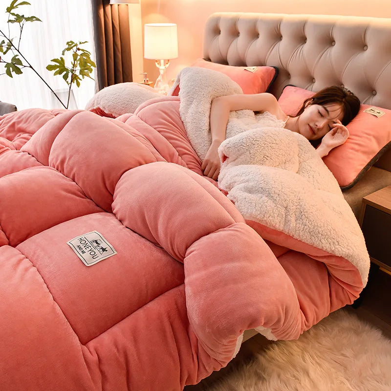 Folded double-sided lamb fleece winter comforter on a linen bed